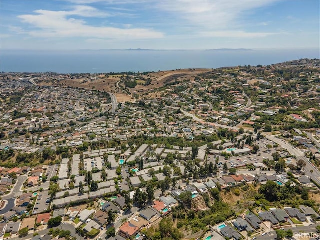 drone / aerial view with a residential view and a water view