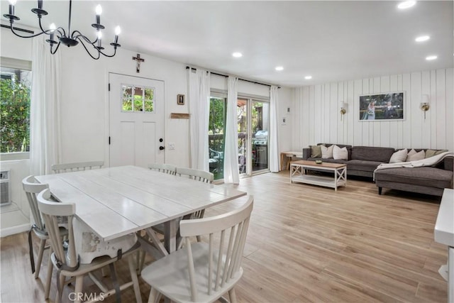 dining area with recessed lighting, a chandelier, plenty of natural light, and light wood-style flooring