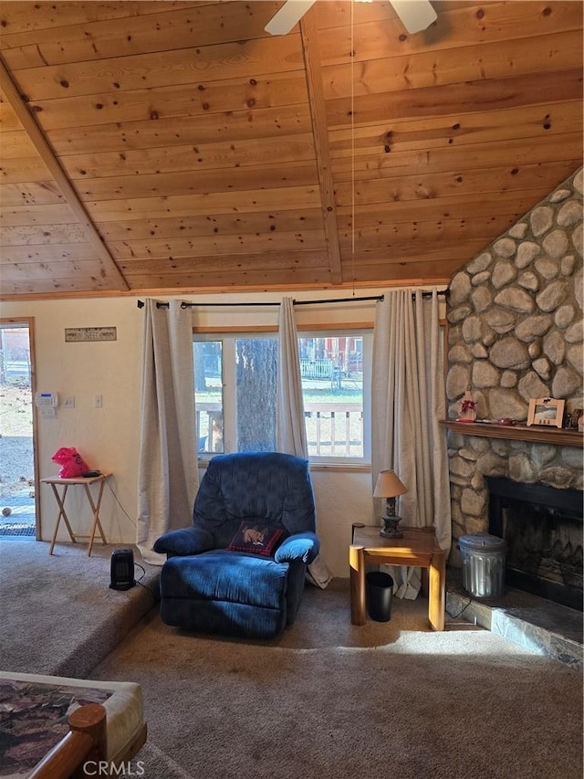 carpeted living room featuring vaulted ceiling with beams, a ceiling fan, a healthy amount of sunlight, and wooden ceiling