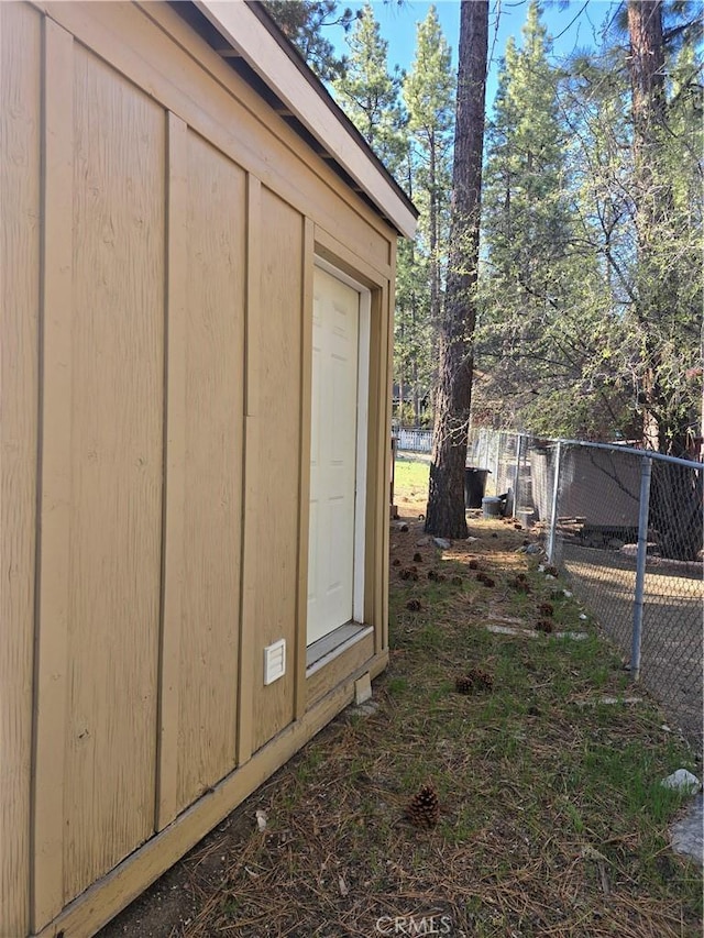 view of outdoor structure featuring fence
