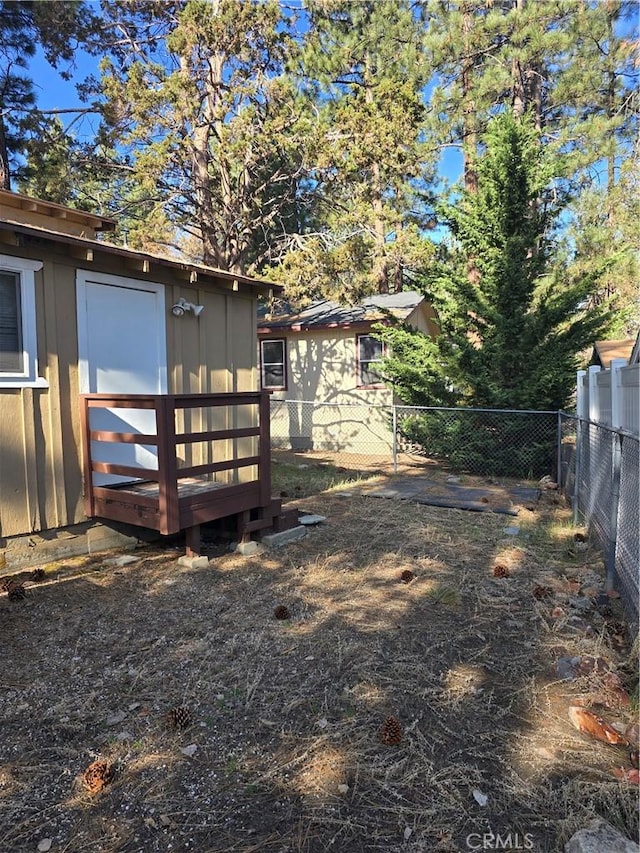 view of yard featuring a fenced backyard and an outdoor structure