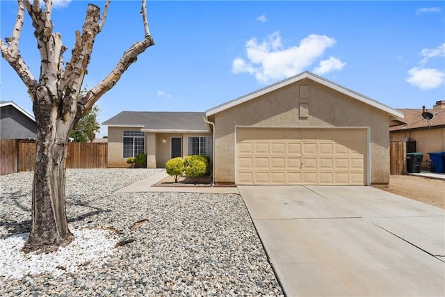 ranch-style house with stucco siding, a garage, fence, and driveway