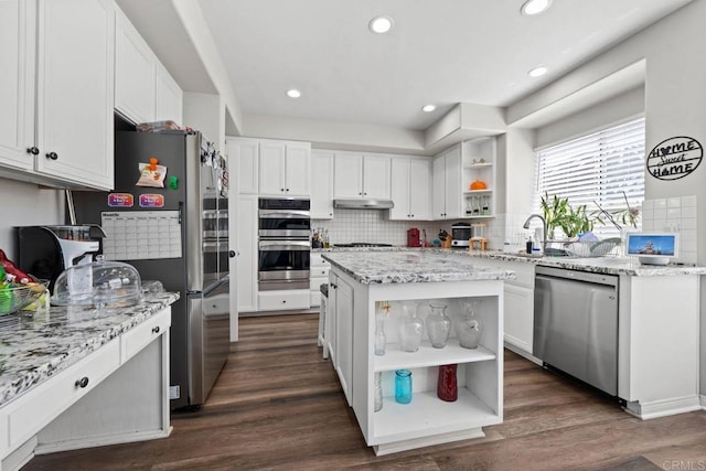 kitchen featuring a sink, appliances with stainless steel finishes, open shelves, and under cabinet range hood