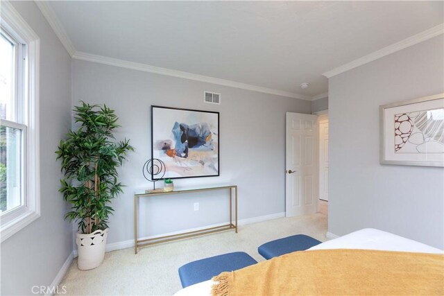 bedroom featuring carpet flooring, baseboards, and ornamental molding