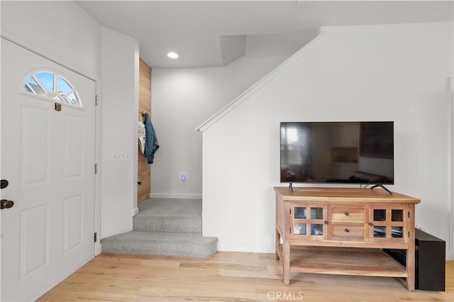 entrance foyer featuring recessed lighting, baseboards, and wood finished floors