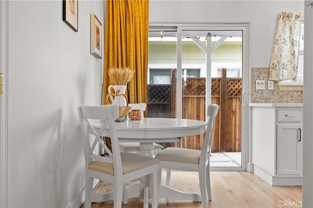 dining area with light wood-type flooring