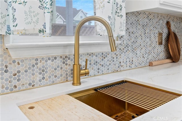 room details with a sink and backsplash