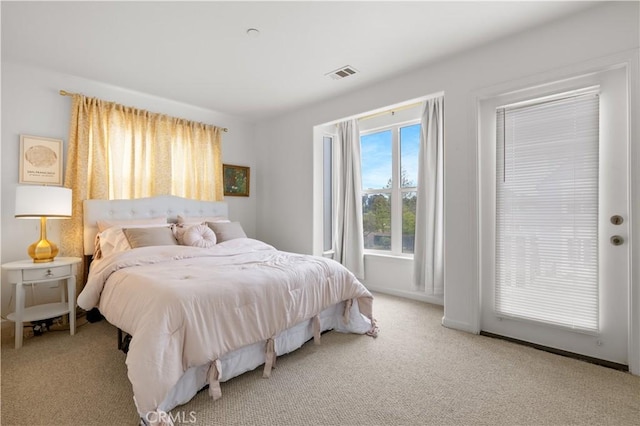 bedroom with carpet floors and visible vents