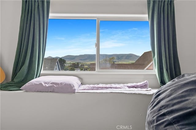 bedroom with a mountain view