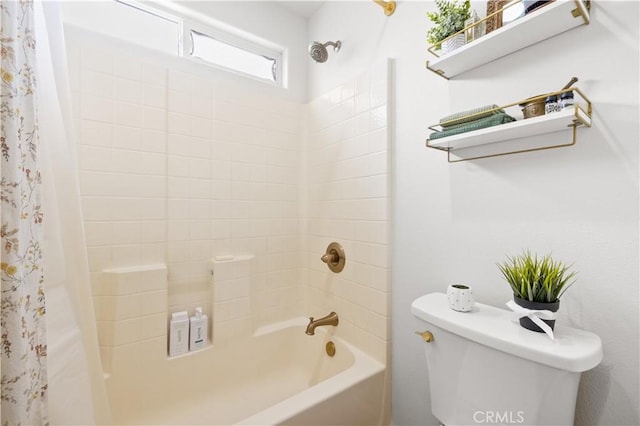 bathroom with shower / bathtub combination with curtain and toilet