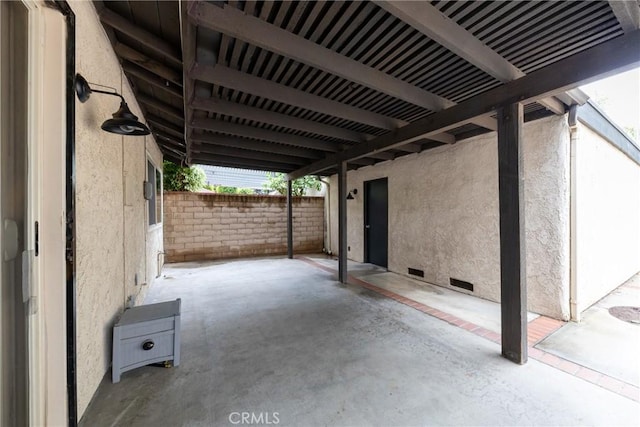 view of patio featuring fence
