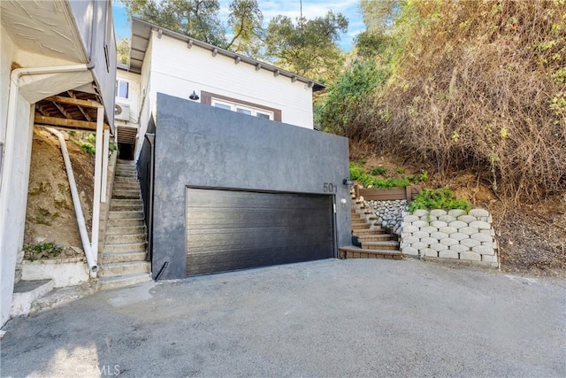 garage featuring driveway