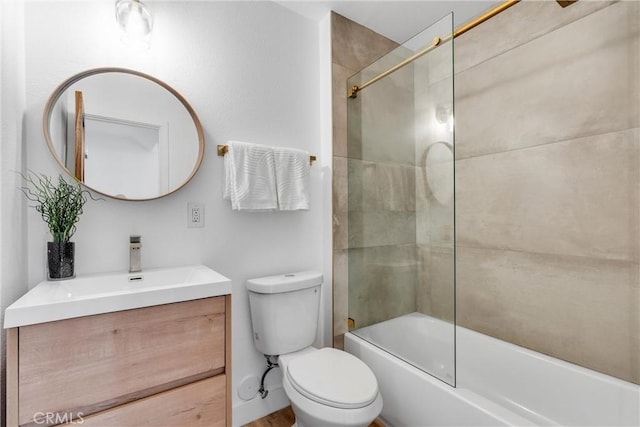 full bathroom with vanity, combined bath / shower with glass door, and toilet