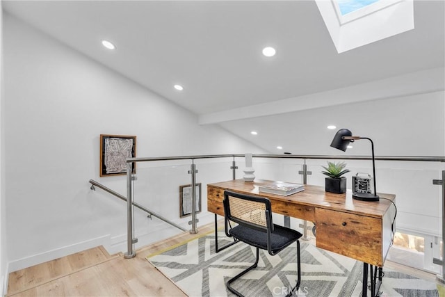 home office featuring recessed lighting, baseboards, lofted ceiling with skylight, and light wood-type flooring