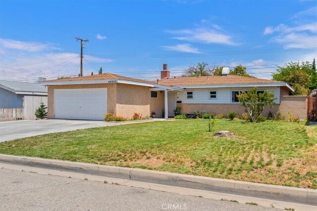 44650 2nd St E, Lancaster, CA 93535 - ranch-style house with concrete driveway, an attached garage, and stucco siding