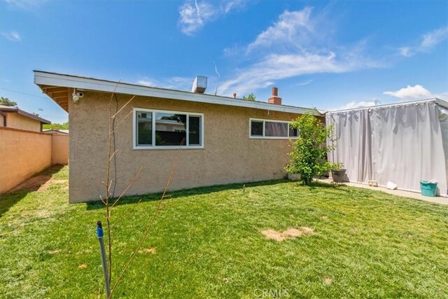 44650 2nd St E, Lancaster, CA 93535 - back of property with stucco siding