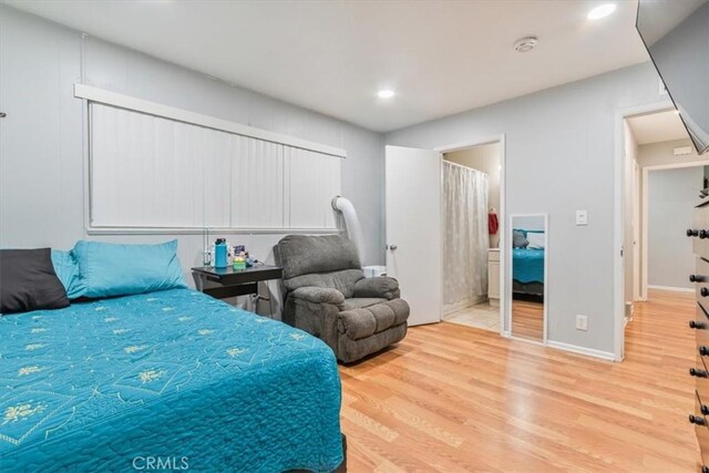44650 2nd St E, Lancaster, CA 93535 - bedroom featuring wood finished floors, recessed lighting, and baseboards