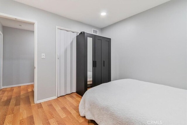 44650 2nd St E, Lancaster, CA 93535 - bedroom with light wood-style flooring, recessed lighting, and baseboards