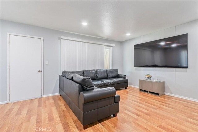 44650 2nd St E, Lancaster, CA 93535 - living area featuring light wood-type flooring, baseboards, and recessed lighting
