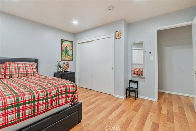 44650 2nd St E, Lancaster, CA 93535 - bedroom featuring light wood-style floors, a closet, baseboards, and recessed lighting