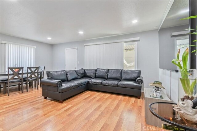 44650 2nd St E, Lancaster, CA 93535 - living area with light wood-style floors and recessed lighting