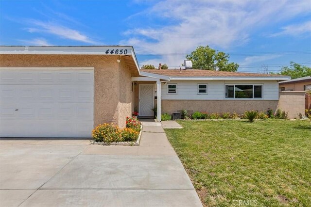 44650 2nd St E, Lancaster, CA 93535 - ranch-style house with a front lawn, concrete driveway, stucco siding, and an attached garage