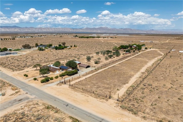 bird's eye view with a desert view, a mountain view, and a rural view