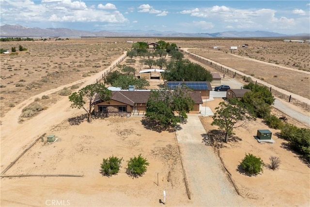 bird's eye view featuring a rural view, a mountain view, and a desert view