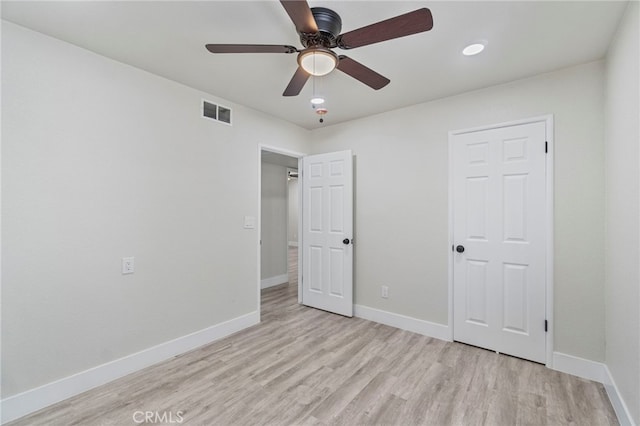 unfurnished bedroom with light wood-style floors, baseboards, and ceiling fan