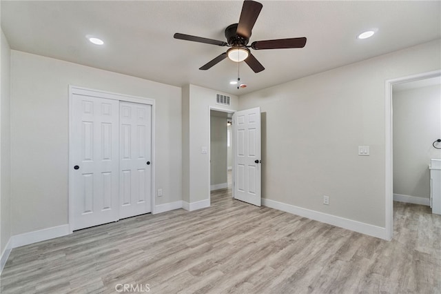 unfurnished bedroom featuring wood finished floors, a closet, baseboards, recessed lighting, and a ceiling fan