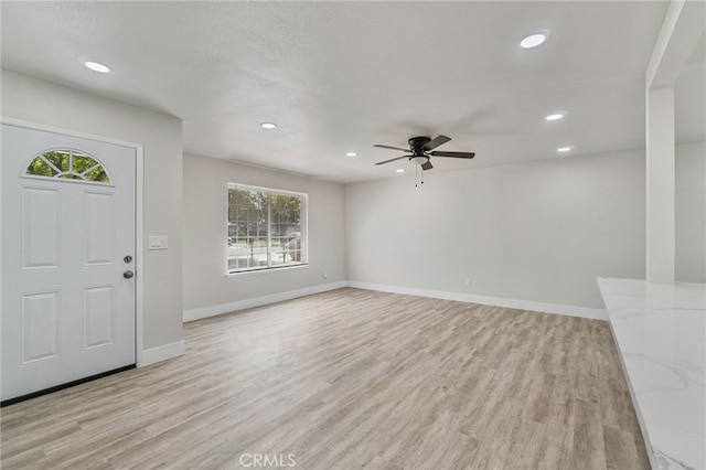 entrance foyer with light wood-style floors, a ceiling fan, baseboards, and recessed lighting