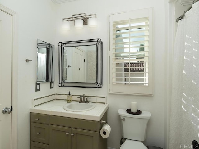 full bathroom with vanity and toilet