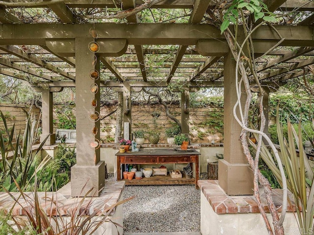 view of patio / terrace featuring fence and a pergola