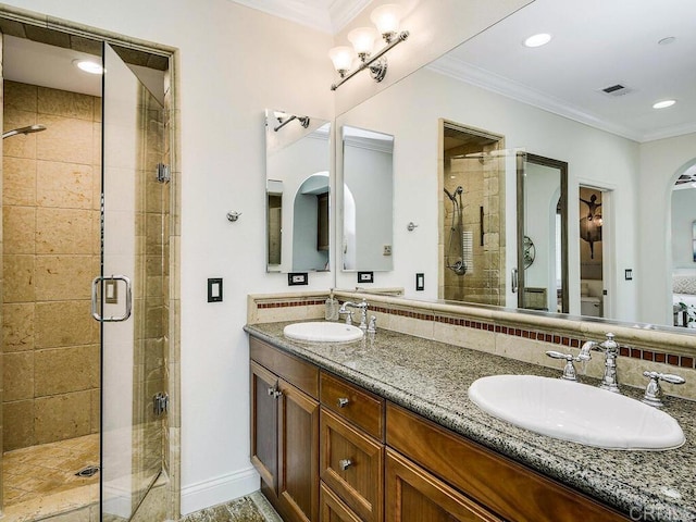 full bath featuring a sink, a stall shower, and visible vents