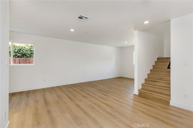 interior space featuring stairs, recessed lighting, baseboards, and visible vents