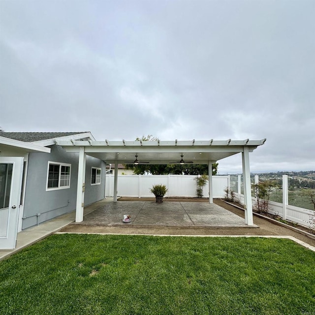 view of parking with a fenced backyard