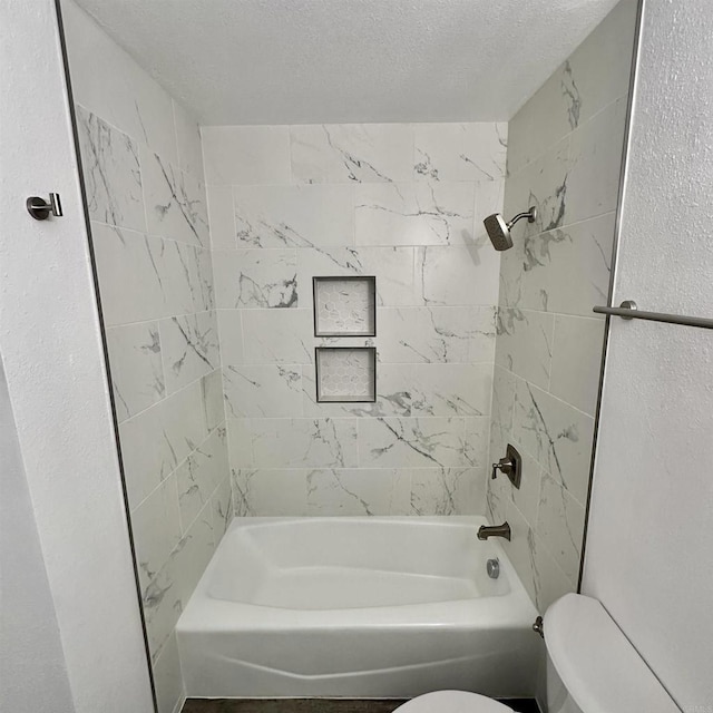 full bathroom featuring bathtub / shower combination and toilet