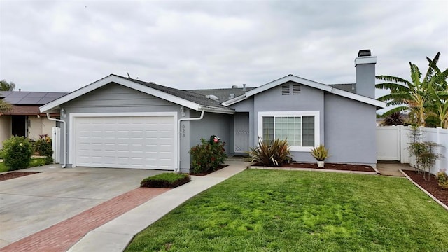 ranch-style home featuring a garage, a front lawn, fence, and driveway