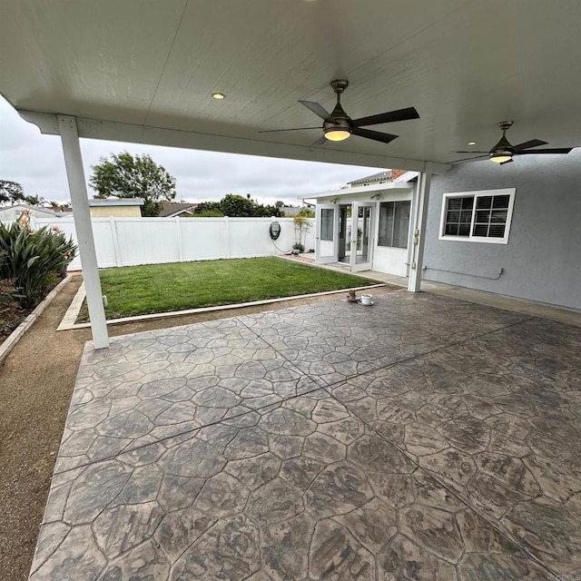 view of patio with ceiling fan and a fenced backyard