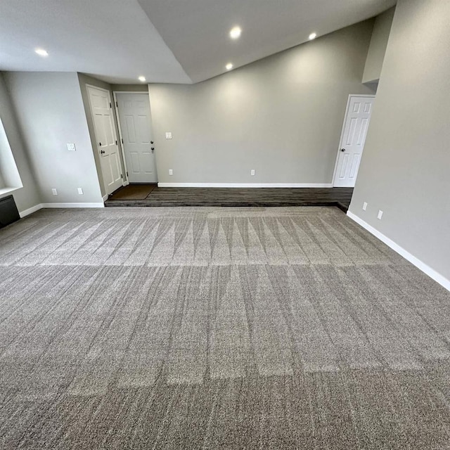 interior space with recessed lighting, baseboards, and dark carpet