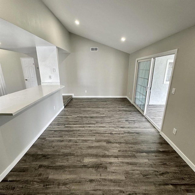 unfurnished dining area featuring visible vents, recessed lighting, dark wood finished floors, and lofted ceiling