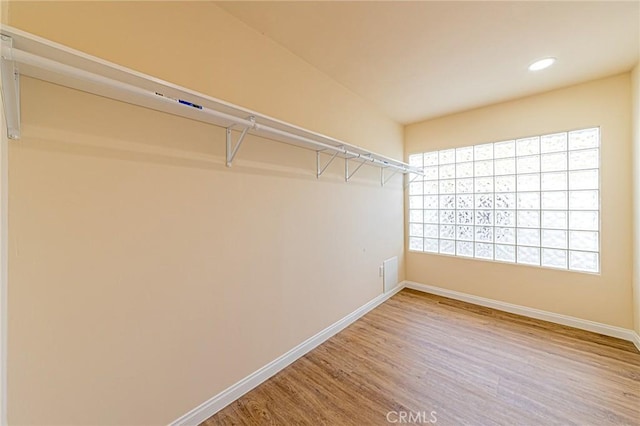 spacious closet with wood finished floors