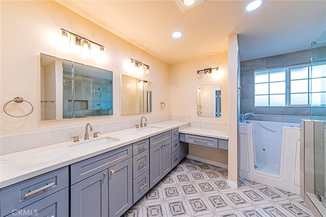 full bathroom featuring double vanity, a sink, an enclosed shower, and recessed lighting