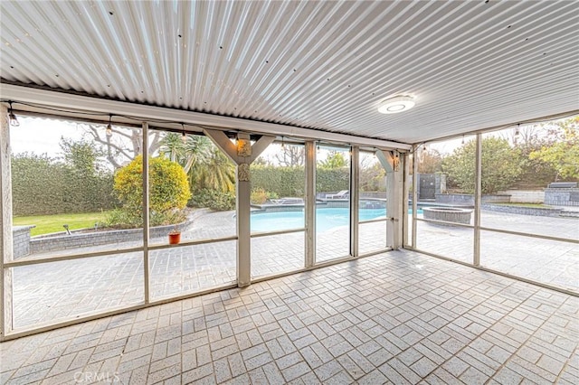 unfurnished sunroom featuring plenty of natural light