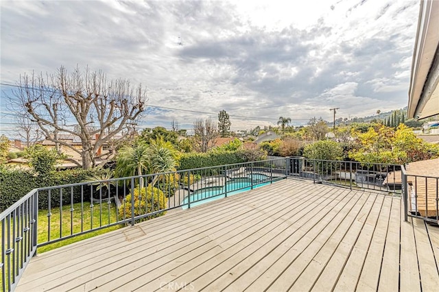 deck with a fenced in pool