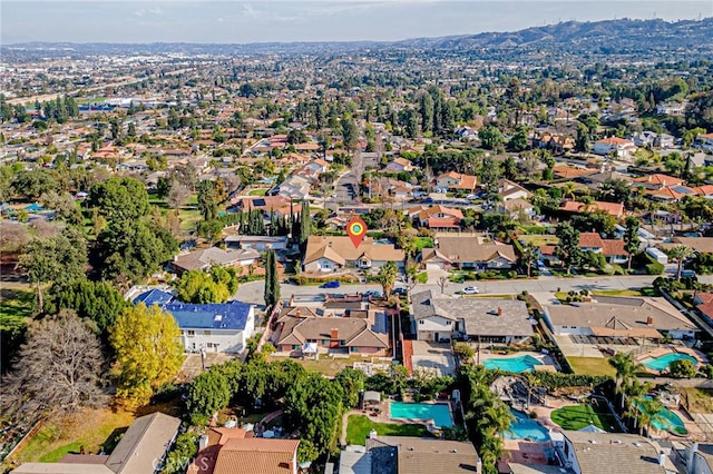 birds eye view of property with a residential view