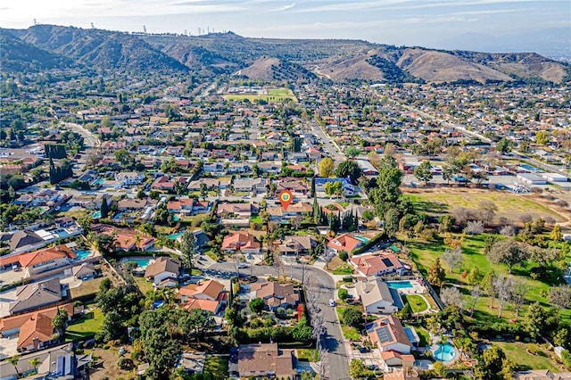 birds eye view of property with a mountain view