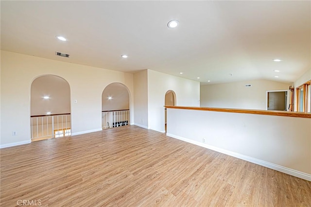 empty room featuring recessed lighting, baseboards, visible vents, and light wood-style floors