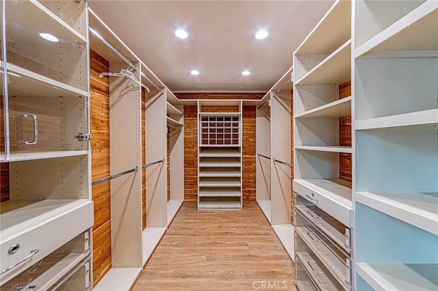 spacious closet with light wood-style floors