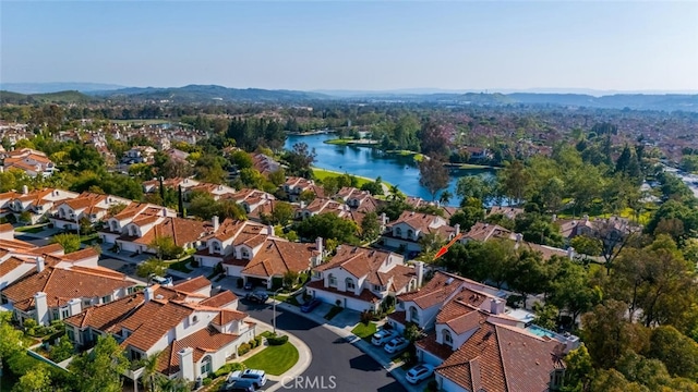 aerial view with a water view and a residential view